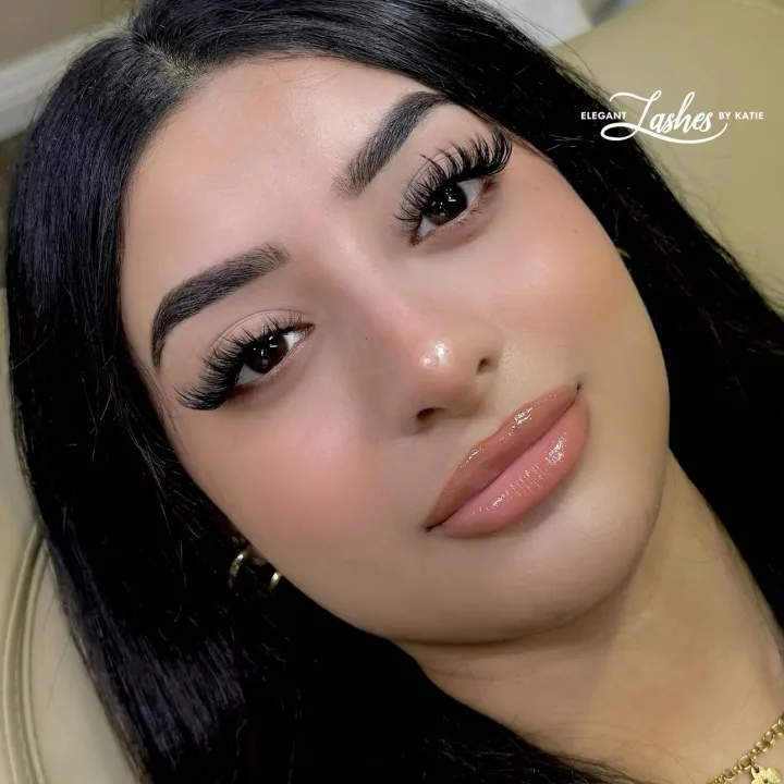 Client wearing a finished lash set by Elegant Lashes By Katie