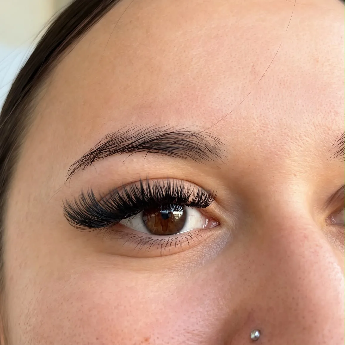 Dense, fluffy Mega Volume lash extensions with a defined lash line
